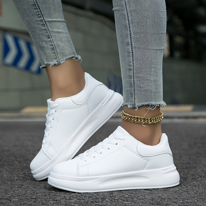 Minimalist white leather casual footwear for women, designed for ultimate comfort and versatility.