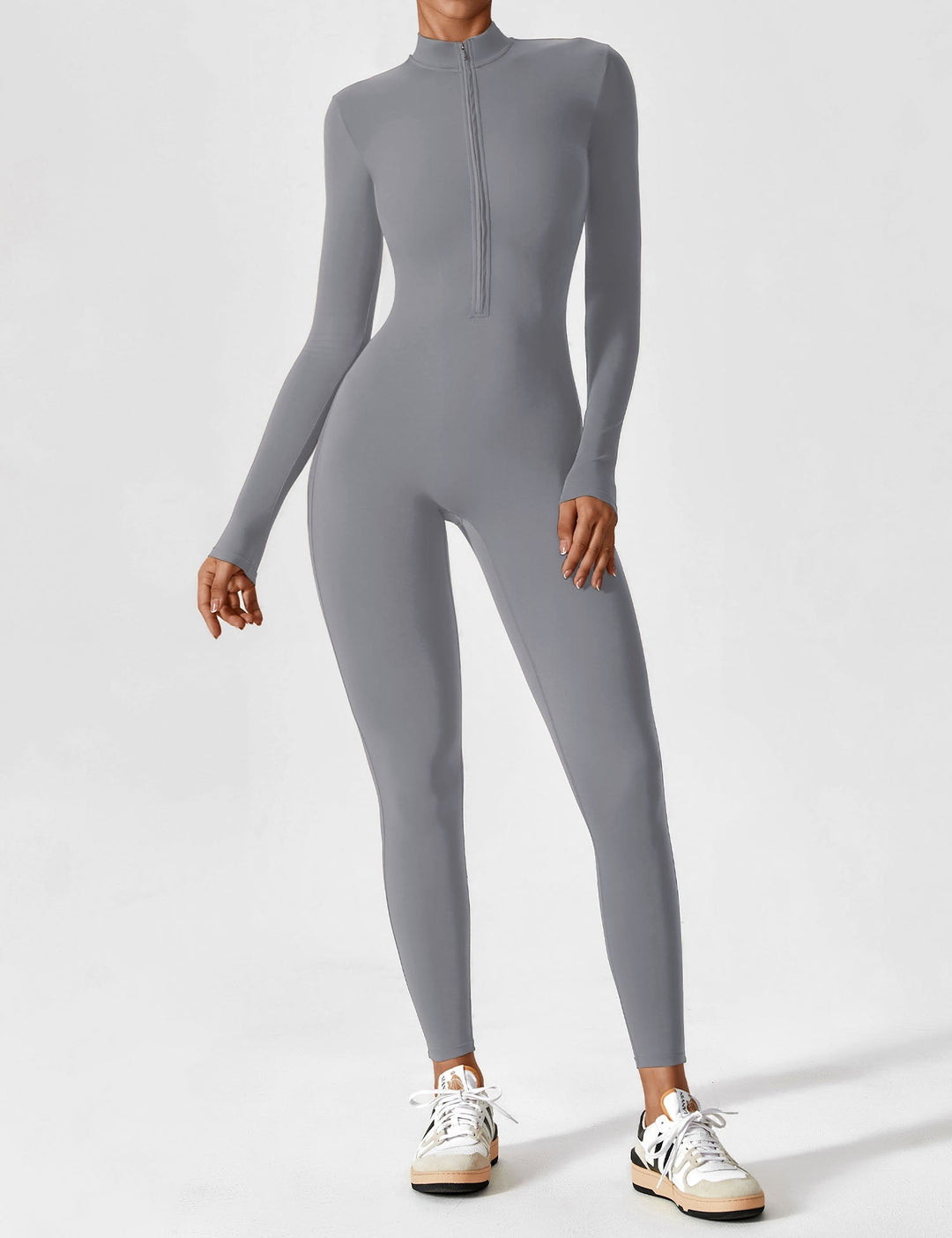 Close-up of zipper pull on women's long sleeve lounge top, quality detail
