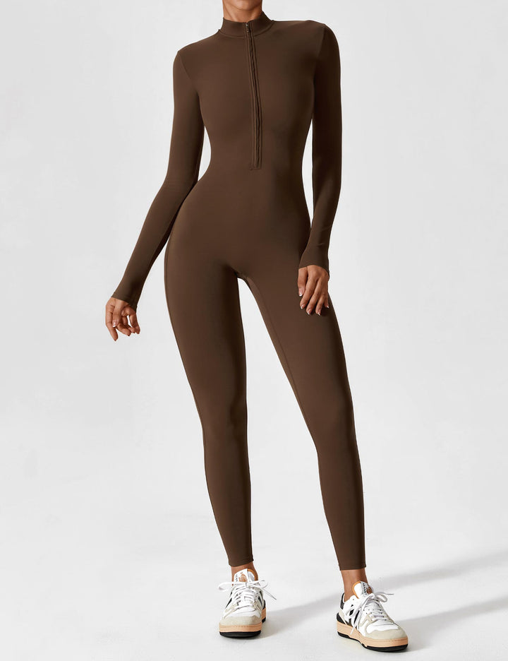 Woman wearing black long sleeve zip lounge set, stylish casual summer outfit