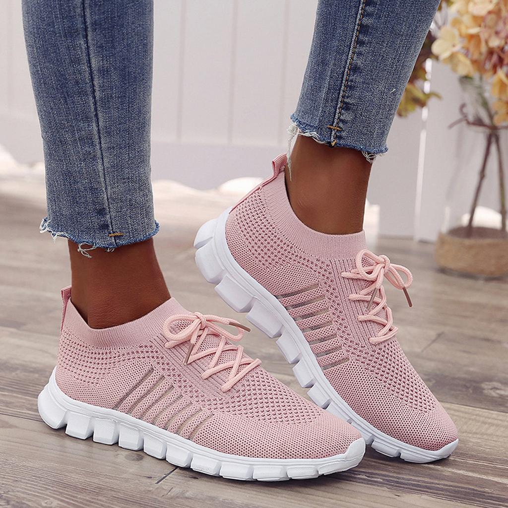 Women's white orthopedic balance sneakers, breathable and lightweight, for comfortable walking.
