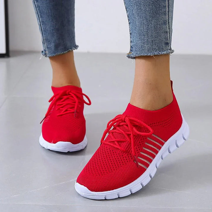 Blue women's orthopedic sneakers, perfect for athletic activities and all-day comfortable wear.