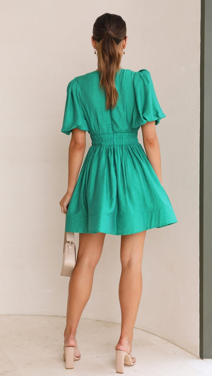 Close-up of the puff sleeve detail on a white spring mini dress for women