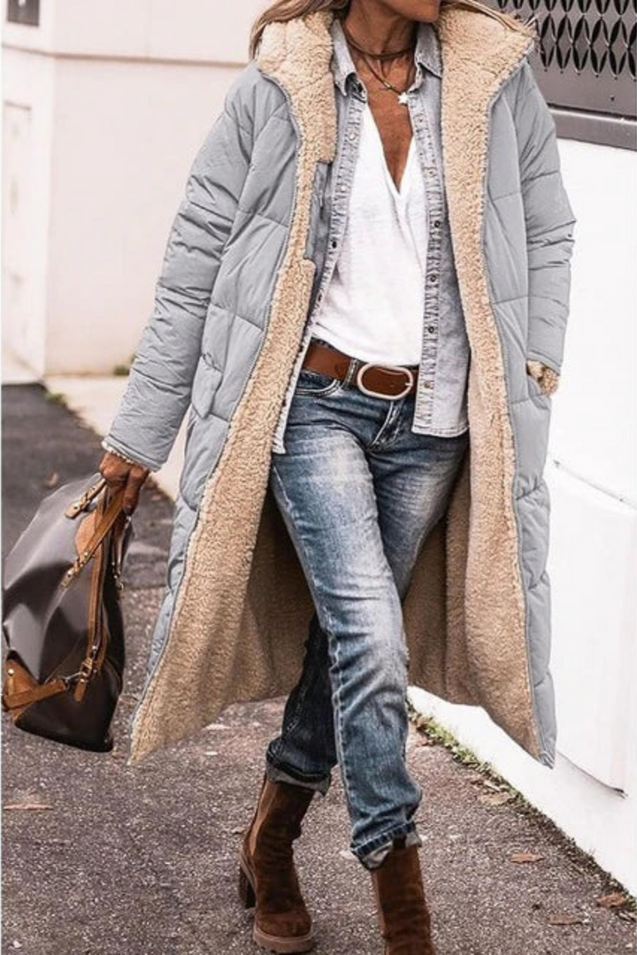 Outdoor women's windproof winter jacket with waterproof insulation, ideal for extreme cold weather conditions.