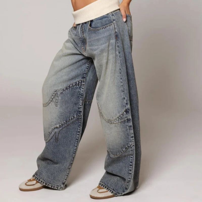 Fashionable women's oversized denim jeans. Featuring a baggy wide leg and comfortable ribbed waist for Y2K style.