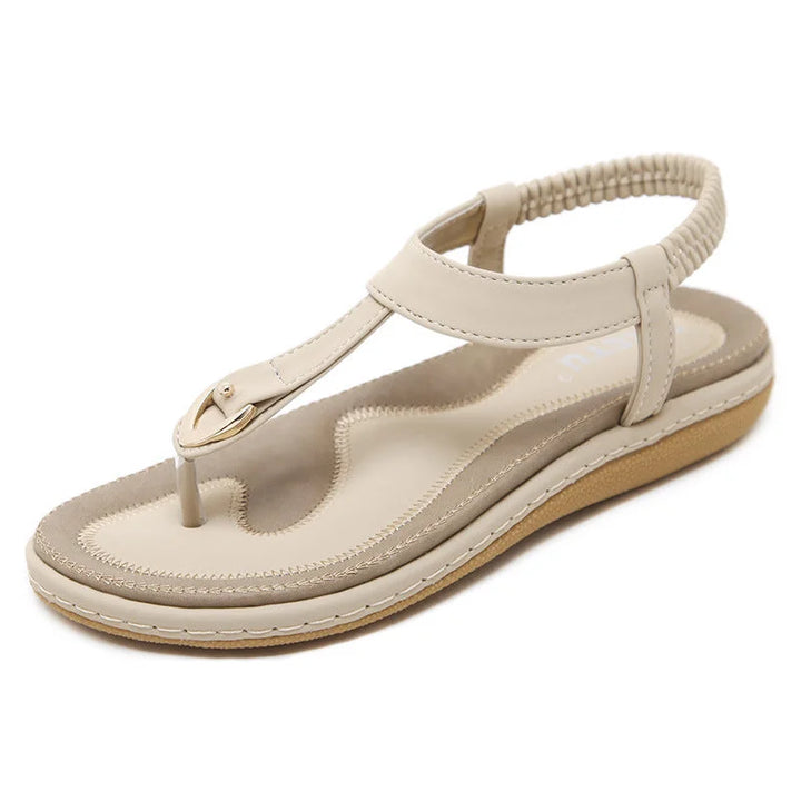 Durable women's flat T-strap sandals with advanced orthopedic arch support for all-day summer comfort.