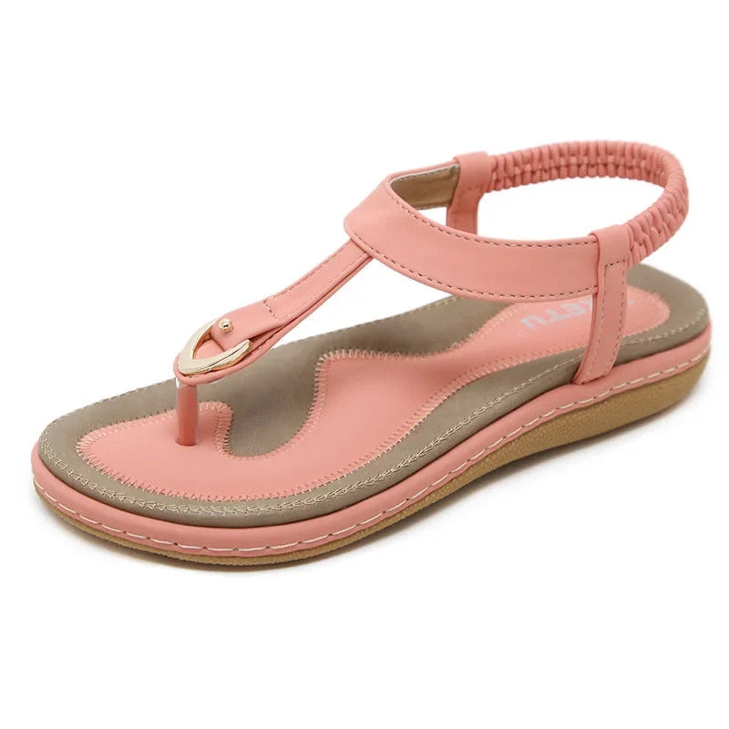 Women's walking sandals: flat T-strap design, orthopedic arch support, & elastic straps for active comfort.