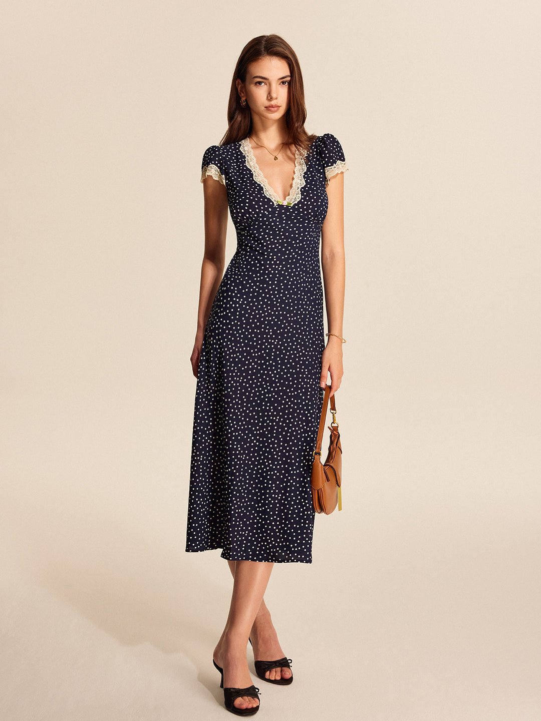 Chic polka dot A-line maxi dress for women, featuring a flattering V-neck and delicate lace trim.