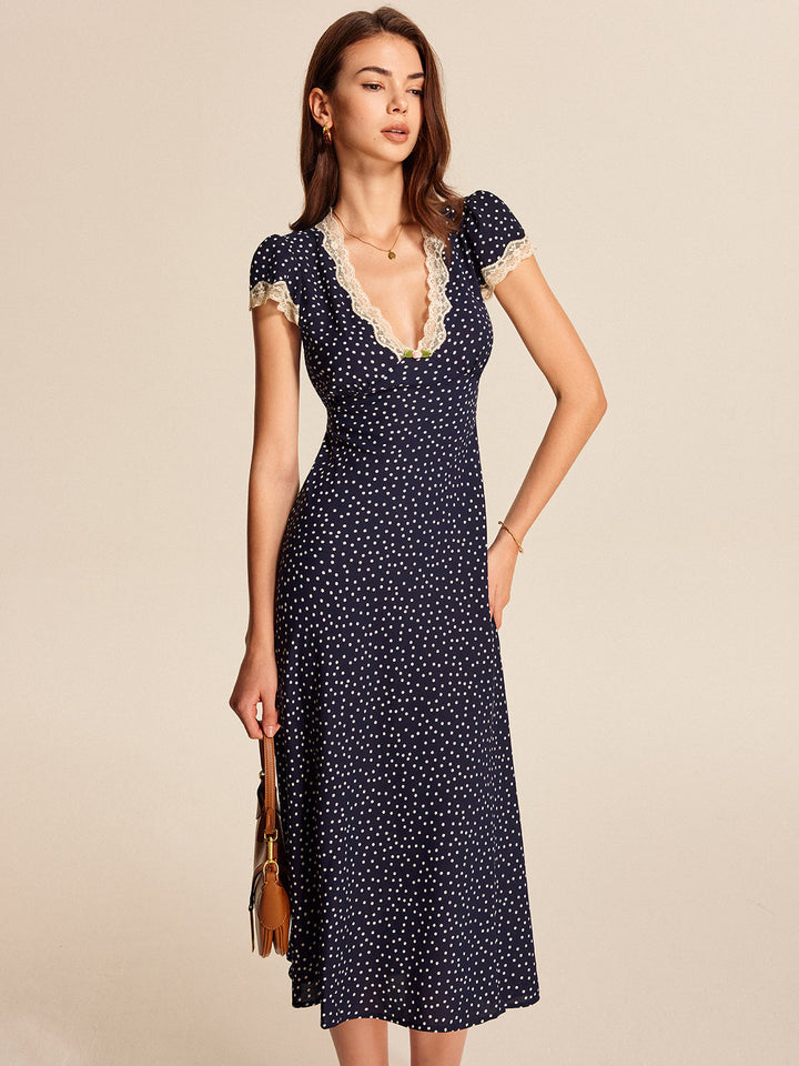 Elegant womens polka dot maxi dress with short sleeves, high waist, and sophisticated lace-trim V-neck.