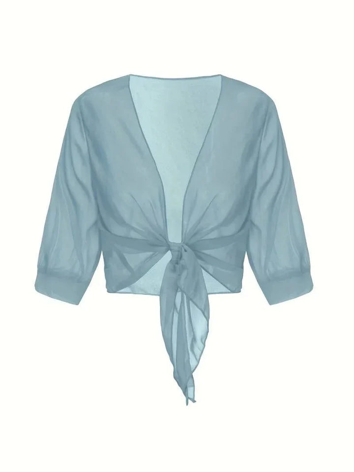 Flowy sheer women's blouse, tie-front, 3/4 sleeves for a relaxed, fashionable resort look.