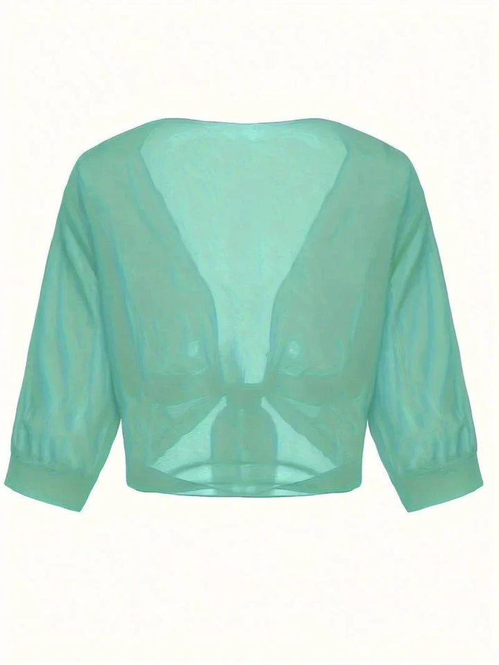 Breathable women's sheer 3/4 sleeve blouse, tie-front, perfect for sunny summer days.