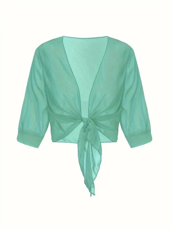 Stylish women's sheer top, 3/4 sleeves, tie-front closure, perfect for casual outings.