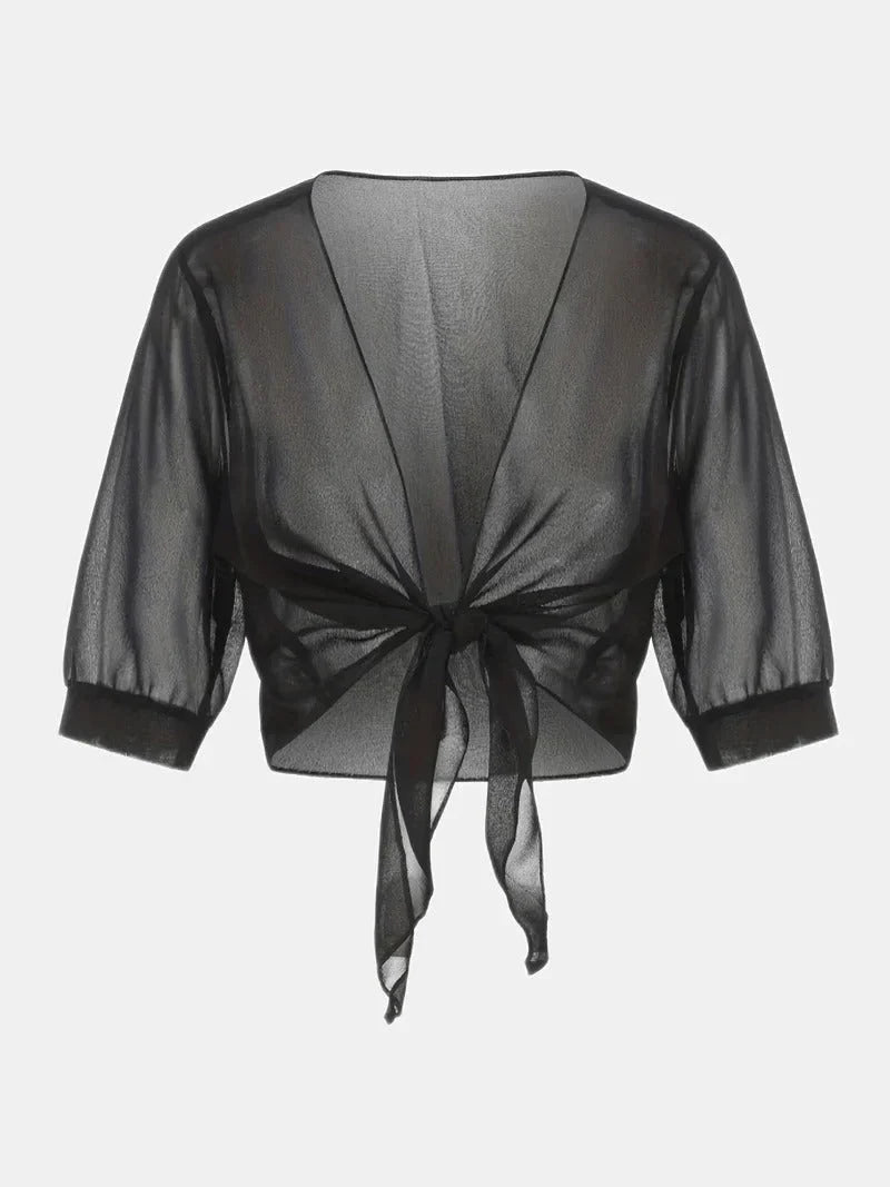 Chic women's sheer blouse featuring a tie-front closure and comfy 3/4 length sleeves.