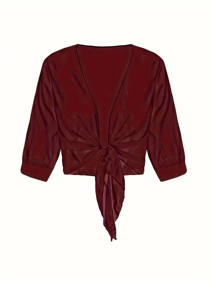 Women's sheer tie-front 3/4 sleeve blouse; lightweight, elegant, and versatile fashion top for ladies.