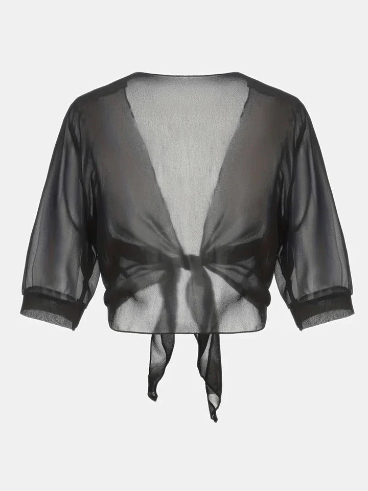 Versatile women's sheer tie-front blouse, 3/4 sleeves, great for day-to-night fashion.