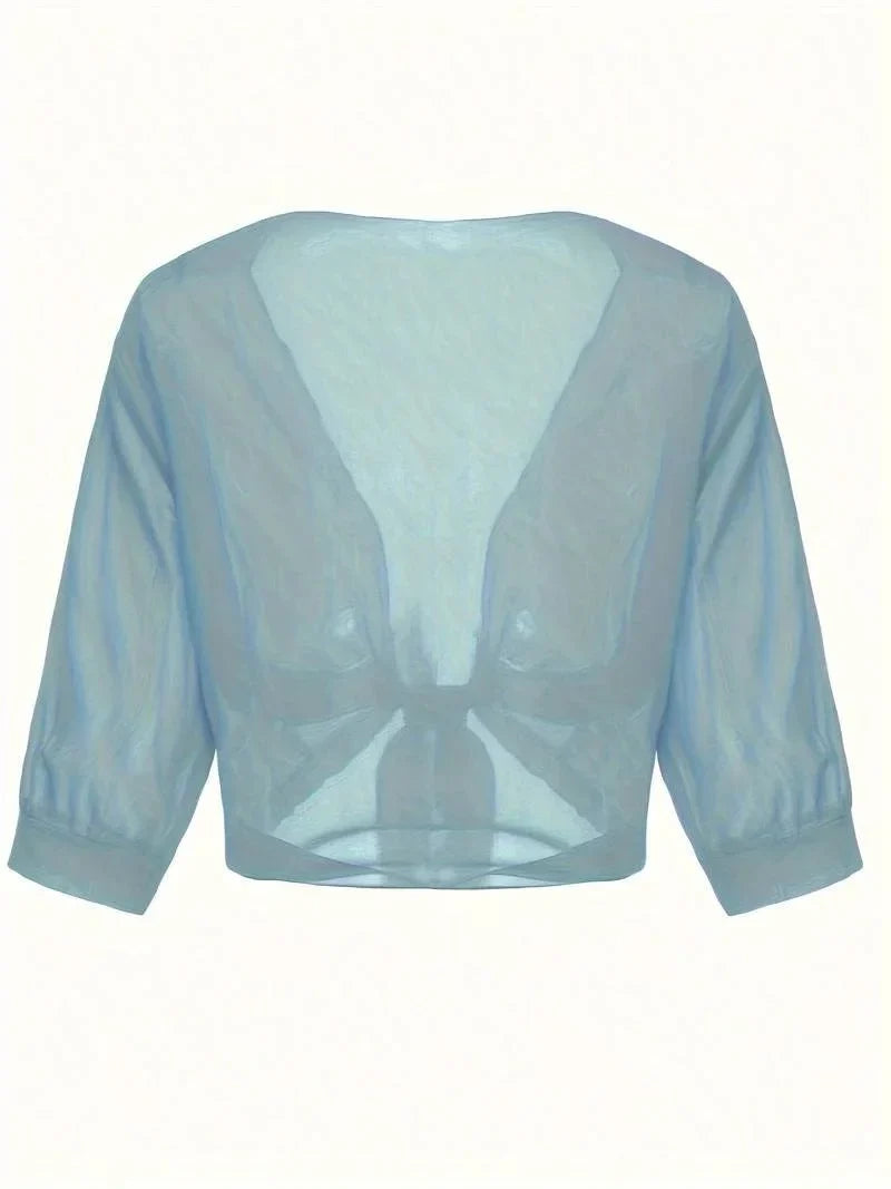 Elegant sheer women's blouse with 3/4 sleeves and a flattering tie-front detail, versatile style.