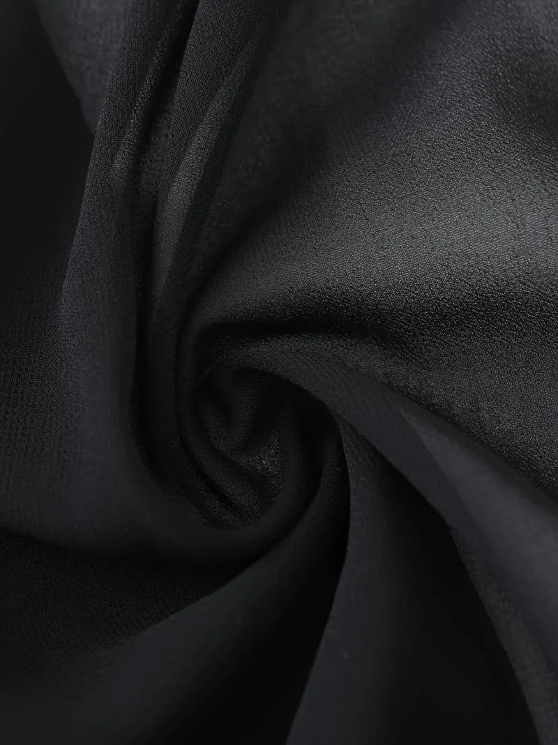 Women's sheer 3/4 sleeve top with tie front, ideal for elegant layering in warm seasons.