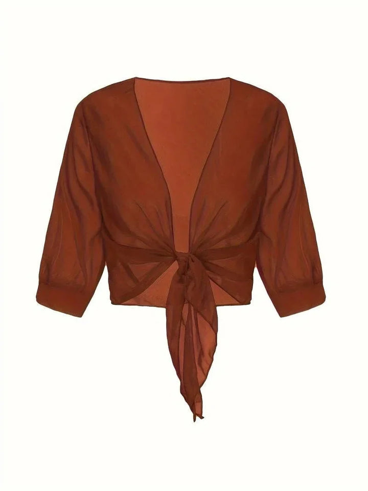 Casual yet elegant women's sheer blouse, 3/4 sleeves, tie-front, ideal for spring and summer.