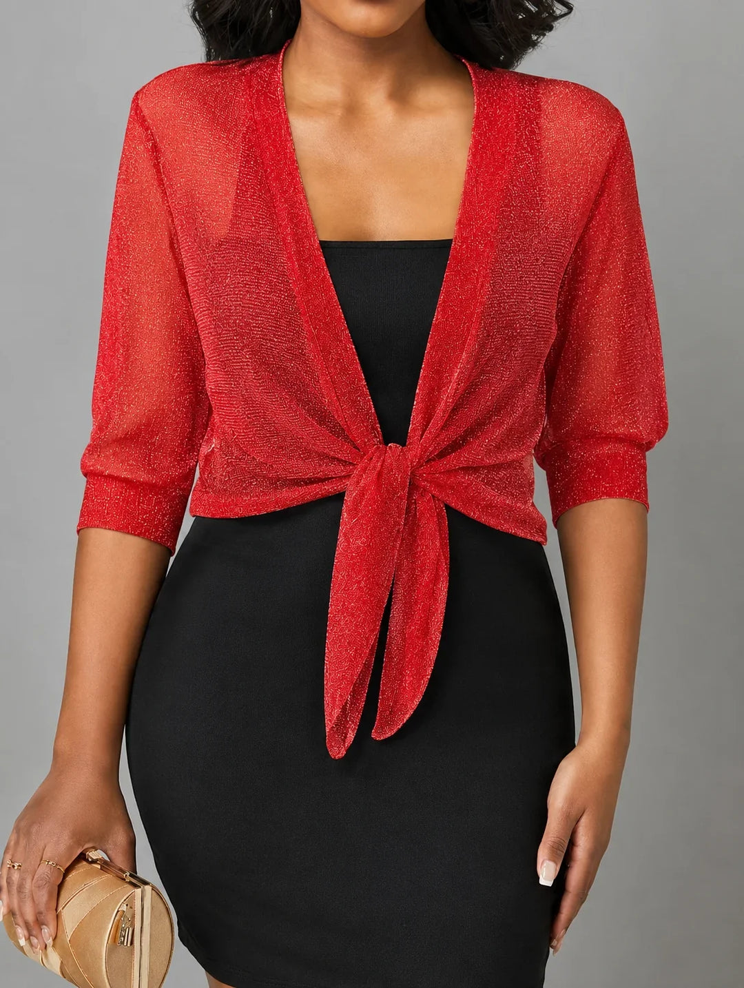 Fashionable women's sheer 3/4 sleeve top with a knotted tie-front detail, airy and light.