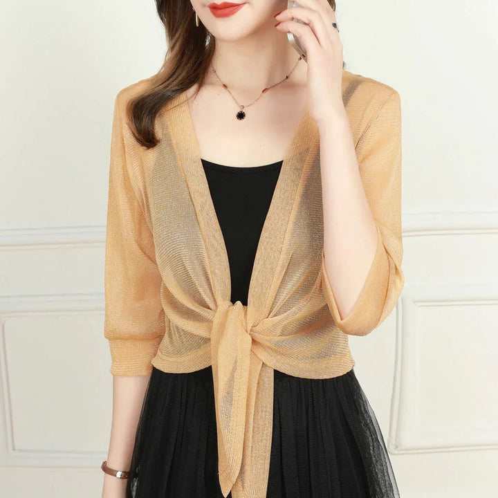 Light translucent fabric women's blouse, 3/4 sleeves, stylish front tie design for summer.