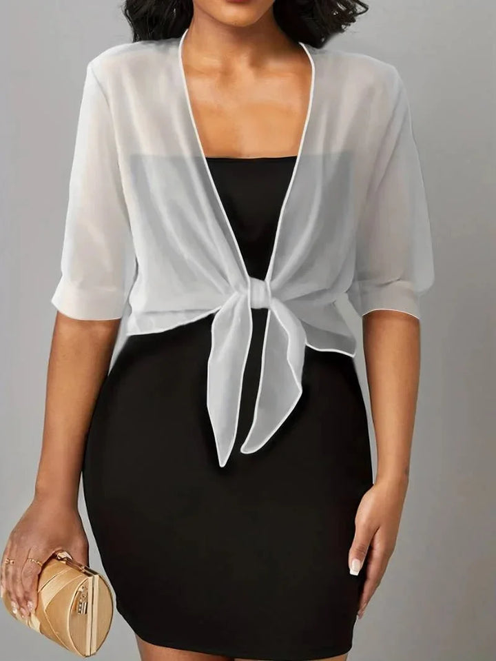 Women's sheer tie-front 3/4 sleeve blouse; elegant, lightweight, perfect for spring fashion.