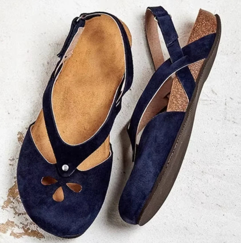 Comfortable women's slingback sandals, featuring stylish closed-toe design with delicate floral cut-outs.