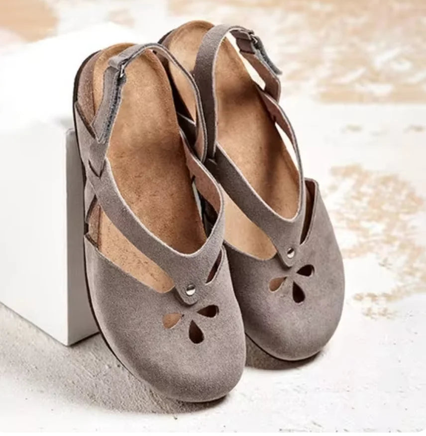 Lightweight women's closed-toe slingback sandals with floral cut-outs, ideal for everyday summer footwear.