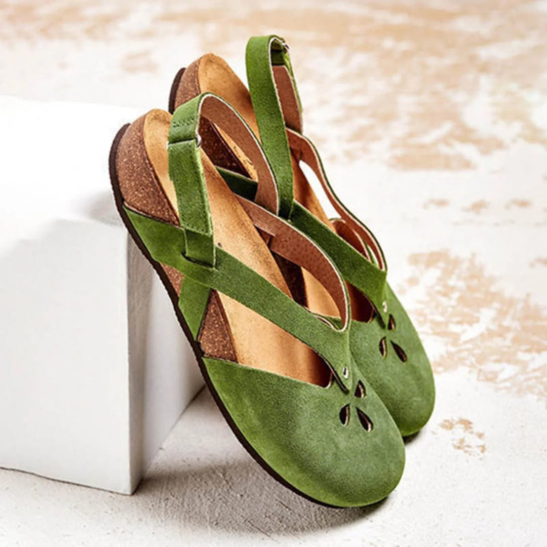 Women's slingback sandals with elegant closed-toe floral cut-outs, perfect for summer casual wear.