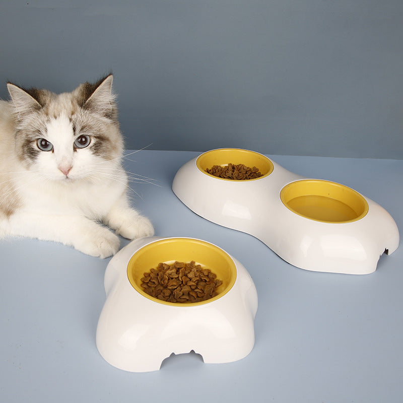 Yellow non-slip double pet bowl set for food & water, perfect for dogs & cats. Pet accessory.