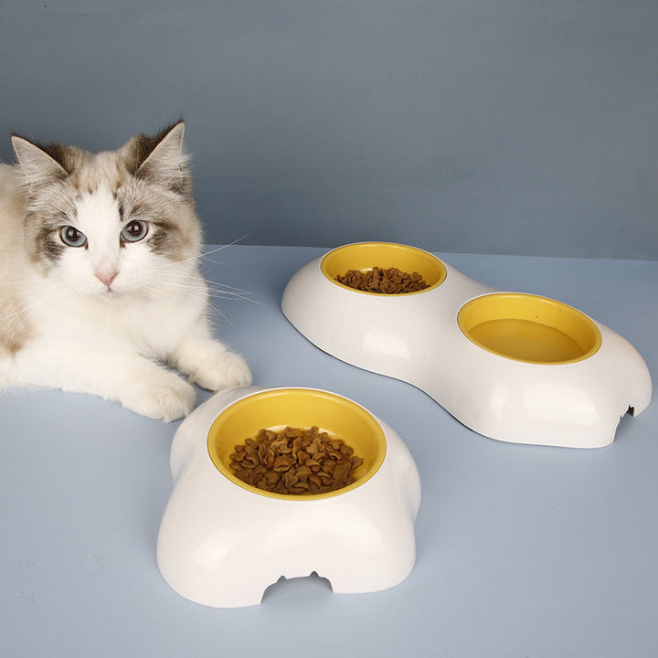Yellow non-slip double pet bowl set for food & water, perfect for dogs & cats. Pet accessory.