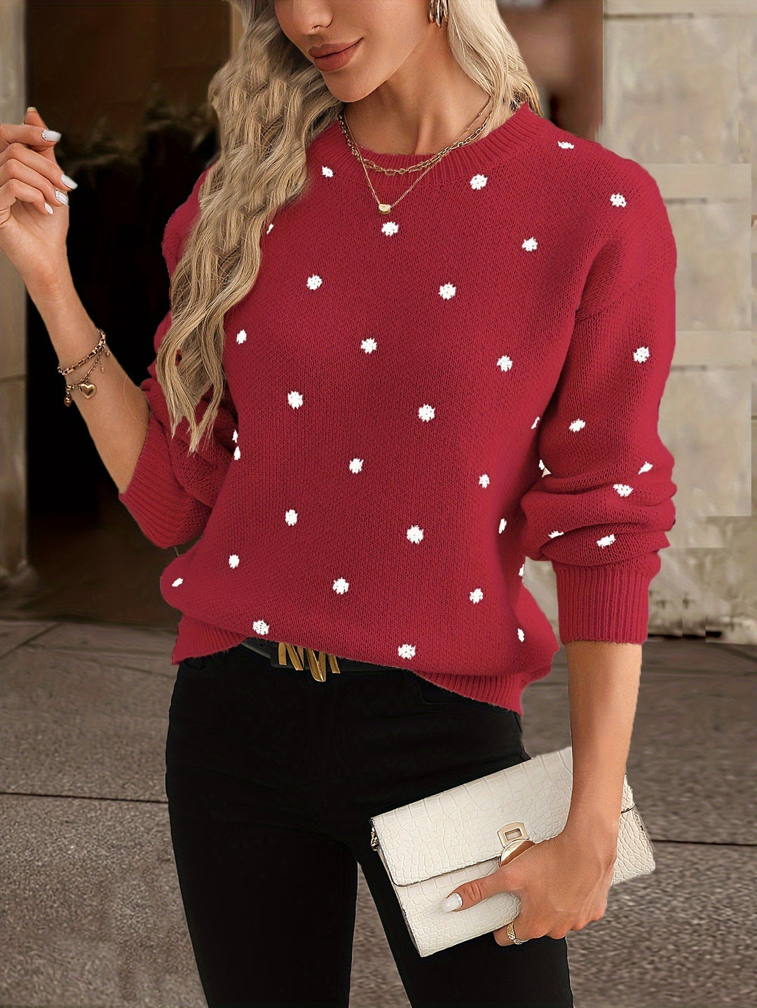 Stylish women's polka dot sweater. Warm, round-neck top for autumn and winter fashion.